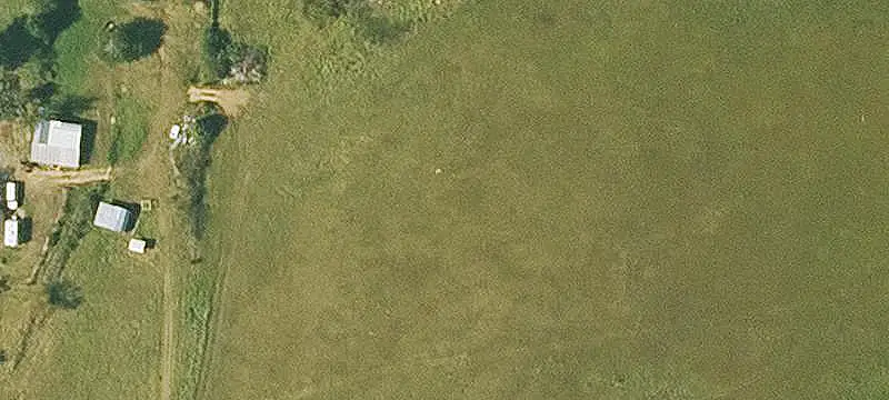 Fenced Agricultural Land With Barn
