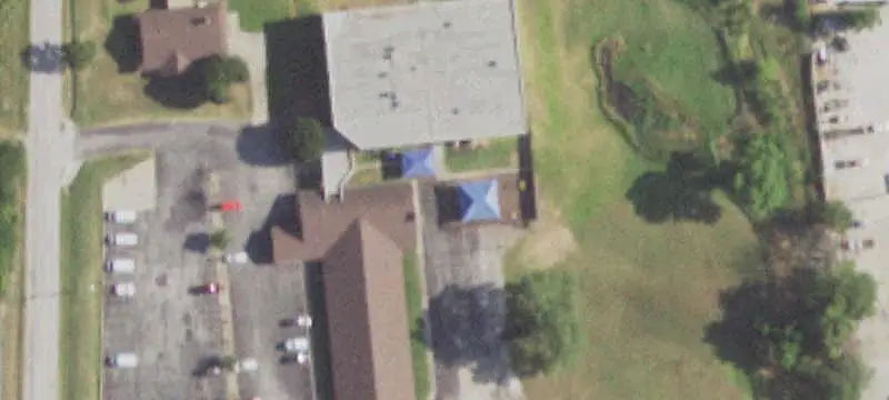 School Building with Basketball Court