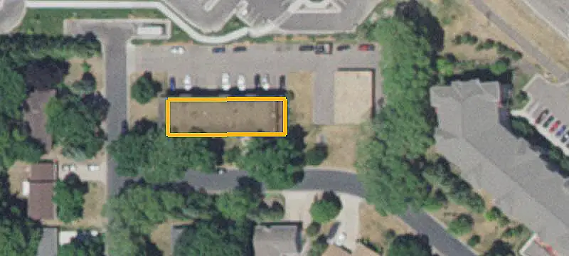 Apartment Building with Detached Garages