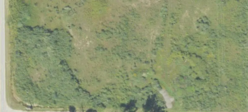 Farmland with Creek and Pond