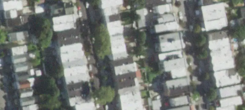 Duplex with Paved Backyard