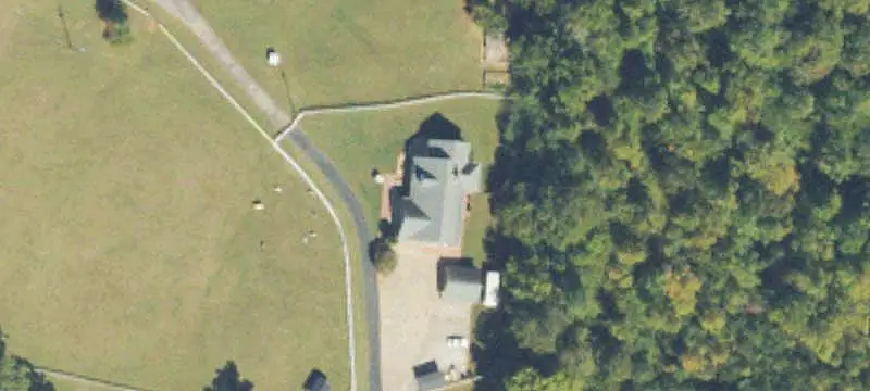 Fenced Farm with Livestock Barns
