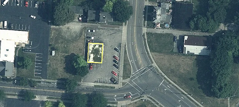 Corner Lot with Operating Car